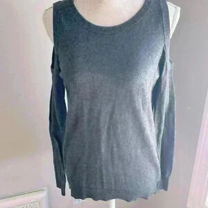 Woman’s large gray sweater top